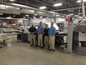 J.S. McCarthy Printers is the first U.S. print shop to operate a Stahlfolder KH 82 with PFX pallet feeder. Vice president Jonathan Tardiff (far right) and his team comprising (from left to right) machine operator Reno Cyr, production manager D.J. Everett, and machine operator Wally Haynes are delighted about doubling productivity and saving so much time. 